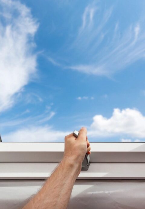 Picture of man opening skylight